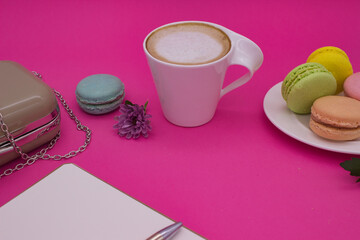 Coffee Break with Macarons on a Pink Background