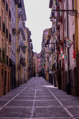 Beautiful narrow spanish ancient street with a modern tropical look