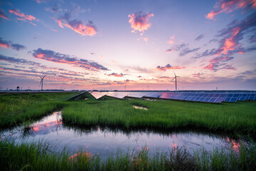 solar power station and wind power turbine at sunset © zhu difeng