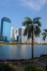 Obraz premium skyscrapers and a pond in a park in Bangkok, Thailand