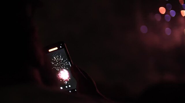 Unknown man records a video of spectacular fireworks