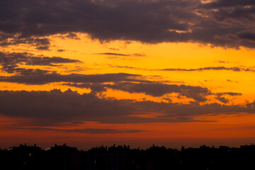 Cloudy Sky over City Rooftops Minutes After Sunset