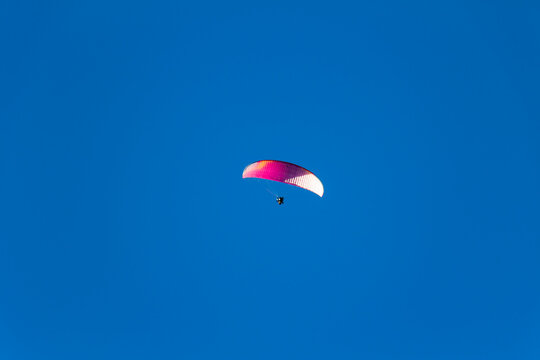 Paraplan and deltaplan in alps over a ski resort