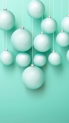 Hanging silver christmas ornaments on light teal background