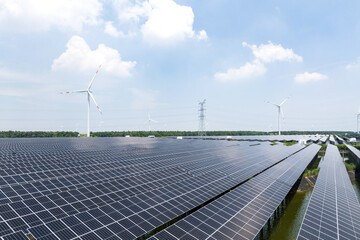 solar power station and wind power turbine over water