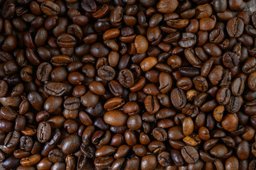 Roasted coffee beans on wooden table