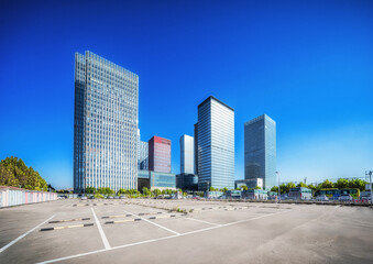 Urban Skyline and Vacant Parking Space on Sunny Day