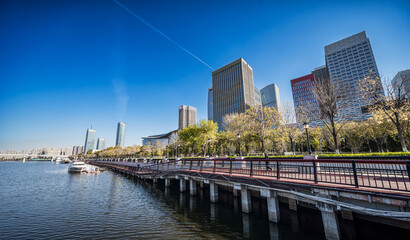 Obraz premium Modern Waterfront Cityscape with Skyscrapers