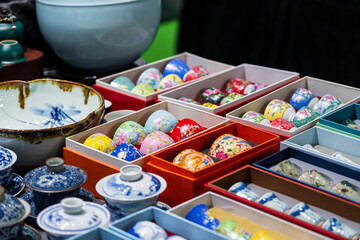 Colorful Decorative Eggs in Beautiful Display Bowls and Boxes