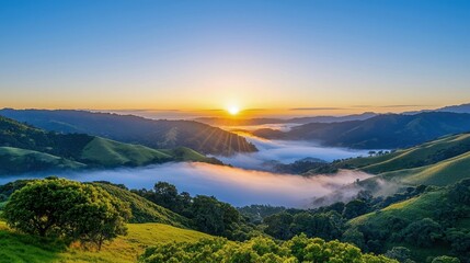 Breathtaking sunrise over rolling hills, with mist rolling in the valleys, showcasing nature's serene beauty and tranquility.