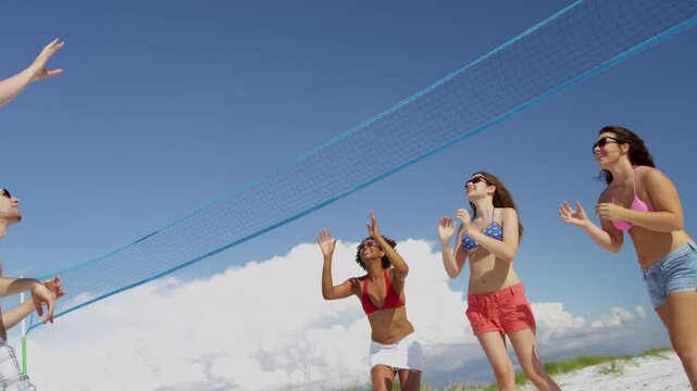Group Teenage Vacation Friends Playing Volleyball Beach