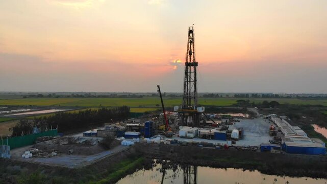 High angle view oil indwelling rig in the rice field