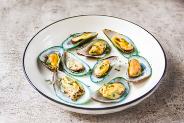 a plate of green mussels as seafood