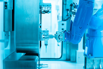 Chemotherapy drug compounding robot with syringe and medicine bottle.Hihg technology pharmaceutical...