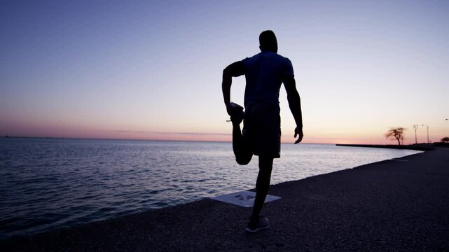 Ethnic African American male silhouette stretching and resting for cardio health