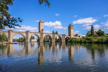 Fototapeta premium Valentré Bridge is a 14th-century six-span fortified stone arch bridge crossing the river Lot to the west of Cahors, in France. It has become a symbol of the city.