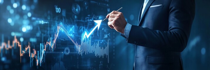 Businessman drawing a growth graph on a digital screen with blue overlays in a corporate environment. Strategic planning and business success concept