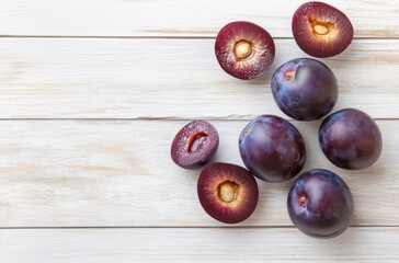 Fresh Plums on a White Wooden Background