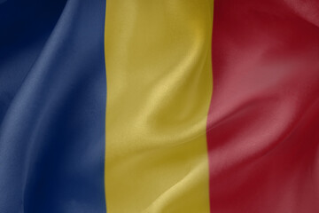Romania waving flag close up fabric texture background