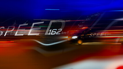 Car travelling at excessive speed at night on the motorway or in the city. Fast light movement...