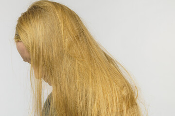 Girl hiding face with hair