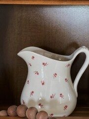 old milk pitcher on table