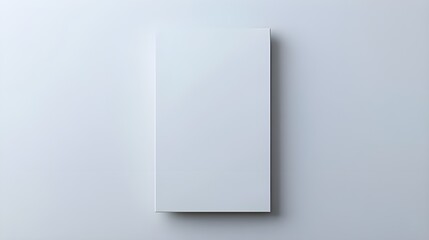 A bright stock photo featuring a blank vertical poster on a white background. 