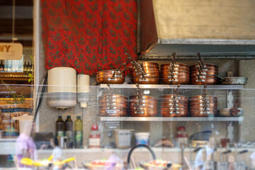 kitchen wall with a shelf where baked breads are stacked