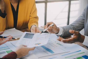 Group of Young Asian business team creative businesspeople coworker in office Happy to be successful partnership teamwork celebrating achievement and success concept.