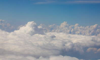 view of white clouds from an airliner during transoceanic flight
