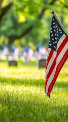 An American flag gently waving in the breeze at a veterans' cemetery, with an emphasis on honoring the fallen, light solid color background