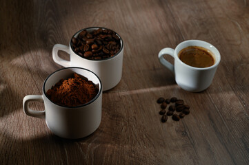 Coffee cup bean close up on natural wooden background. Morning breakfast concept