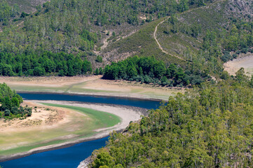 View of the Melendo Meander of the Alagon River with forests and hills between the Spanish...
