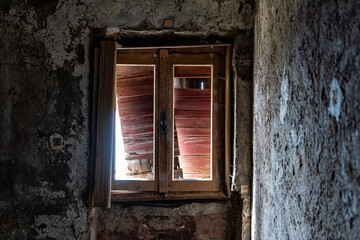 Old ruined window in an abandoned building