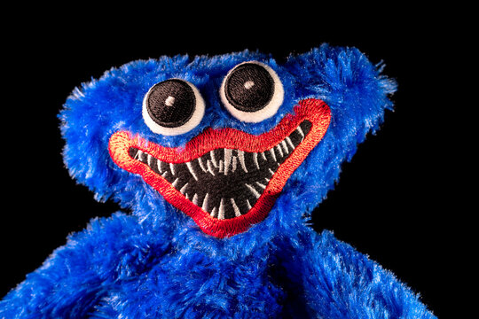 Huggy Wuggy from the Poppy Playtime on the black background