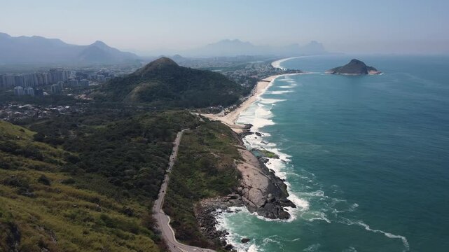 Aerial view of Playa de Samil, the main beach of Vigo in Galicia in northwest Spain. Sunny day, crystal clear blue sea. Houses, streets. Drone take.
