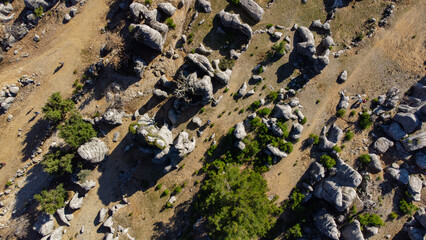 Geological landscape with beautiful rock formations and evergreen trees. Antalya, ancient city of...