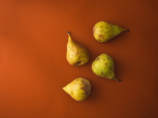 Pears isolated over orange background
