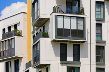 Fototapeta premium Elements of architectural decorations of buildings, modern windows, walls and balconies.