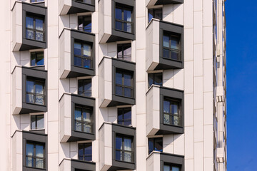 Elements of architectural decorations of buildings, modern windows, walls and balconies.