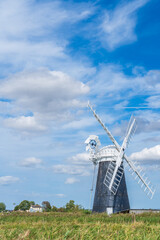 Halvergate Windmill in the Norfolk Broads National Park in the UK in portrait orientation