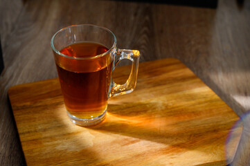 a cup of tea on a table. glass