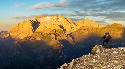 morning panoramic view of mount Marmolada with hiker