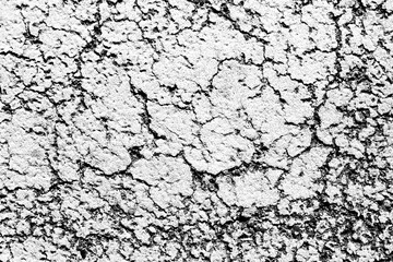 Black cracks background. Scratched lines texture. White and black distressed grunge pattern. Peel paint crack. Weathered rustic surface. Dry paint overlay. Cracked asphalt backdrop.
