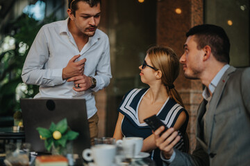 Casual business meeting with diverse professionals collaborating over coffee in a cafe setting. Engaging conversation and idea exchange in a relaxed environment.