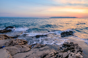 Colorful sunset on Makarska Riviera, popular touristic coastline of the Adriatic Sea in Split-Dalmatia County of Croatia
