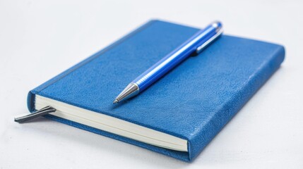 Blue Notebook and Pen on White Background