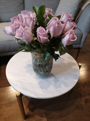 Bouquet of lavender roses on marble table
