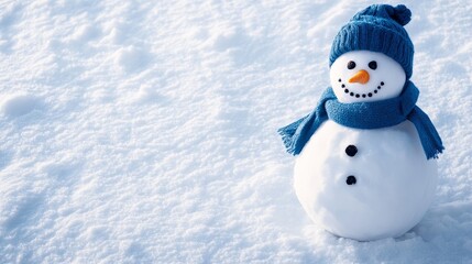 Obraz premium A cheerful snowman stands in a snowy landscape, wearing a blue hat and scarf. The snowman has a bright smile and two black eyes, symbolizing joy and winter fun. The blue accessories add a touch of vib