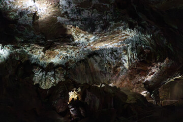 Photograph of stalagmites, stalactites, and other limestone rock formations on the inside of Yarrangobilly Caves near Talbingo in Kosciuszko National Park in the Snowy Mountains in Australia